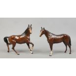 Two Royal Doulton ceramic figures of horses.