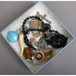 A box of costume jewellery including tigers eye and a silver and enamel brooch (AF).