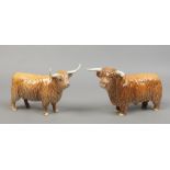 Two Beswick models of highland cattle.Condition report intended as a guide only.One with restoration