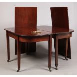 A 19th century mahogany D-end dining table. Raised on square tapering supports terminating on