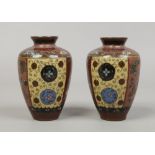 A pair of Japanese Meiji period cloisonne bud vases. With ground panels decorated with butterflies