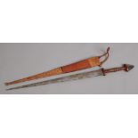 An African tribal short sword with snakeskin and leather scabbard braided leather grip and