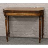 A Victorian mahogany fold over table.