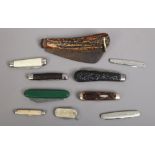A collection of pocket knives including advertising examples, multi tool and an antler scaled