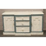 A painted Victorian pine breakfront sideboard.