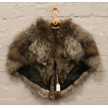 A silver fox fur stole.