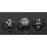 Three dress rings set with white paste stones including two 9ct gold and silver and one silver