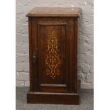 A Victorian rosewood pot cupboard.