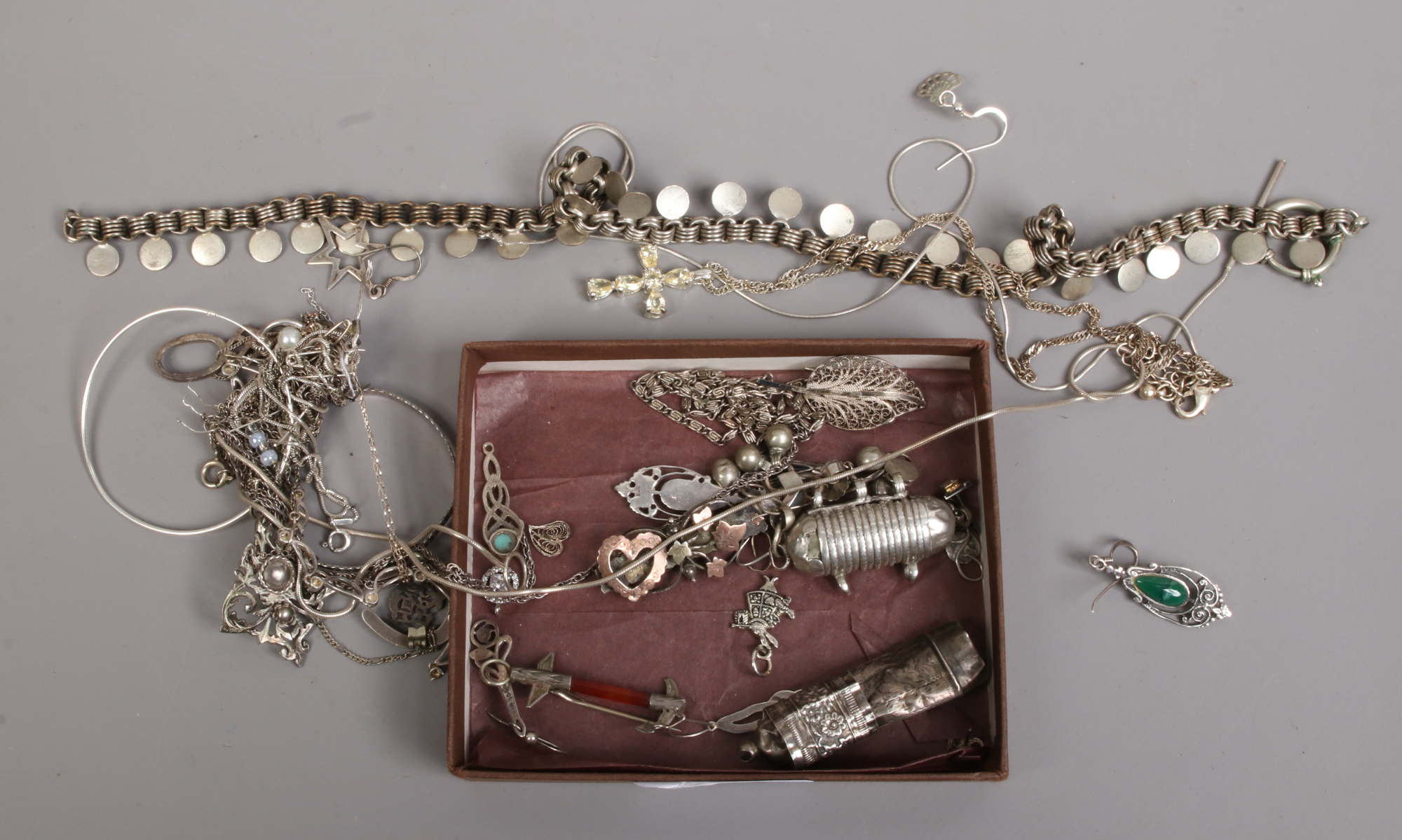 A quantity of silver and white metal jewellery oddments, including brooches, necklaces, earrings