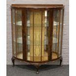 A mahogany bow front china display cabinet raised on squat cabriole legs.Condition report intended