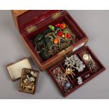 A vintage brown leather jewellery box and contents of collectables including marcasite brooches,