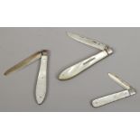 Three silver fruit knives with mother of pearl scales including Victorian and Edwardian examples.