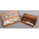 A miniature chest of drawers and cigar box with contents of cigarette and tea cards to include