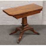 A Regency rosewood fold over card table.