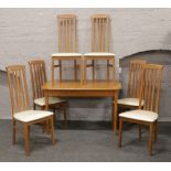 A Caxton furniture dining table and set of six chairs.
