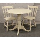 A painted centre pedestal breakfast table with crackle glazed decoration along with a pair of