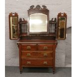 A Victorian mahogany triple mirror dressing table.