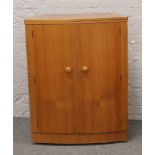 A teak Turnidge metamorphic drinks cabinet / bar.