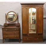 An Edwardian mahogany mirror front wardrobe and dressing table quarter veneered and with blind