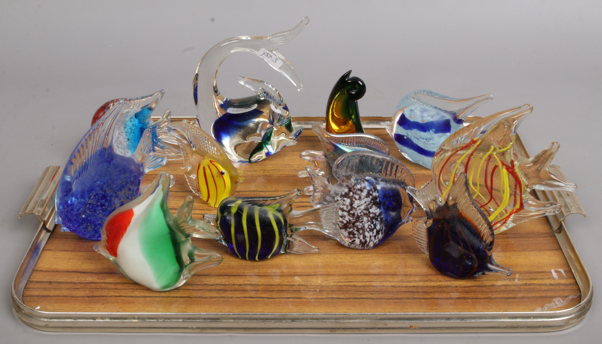 Twelve Murano style glass tropical fish paperweights.
