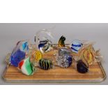 Twelve Murano style glass tropical fish paperweights.