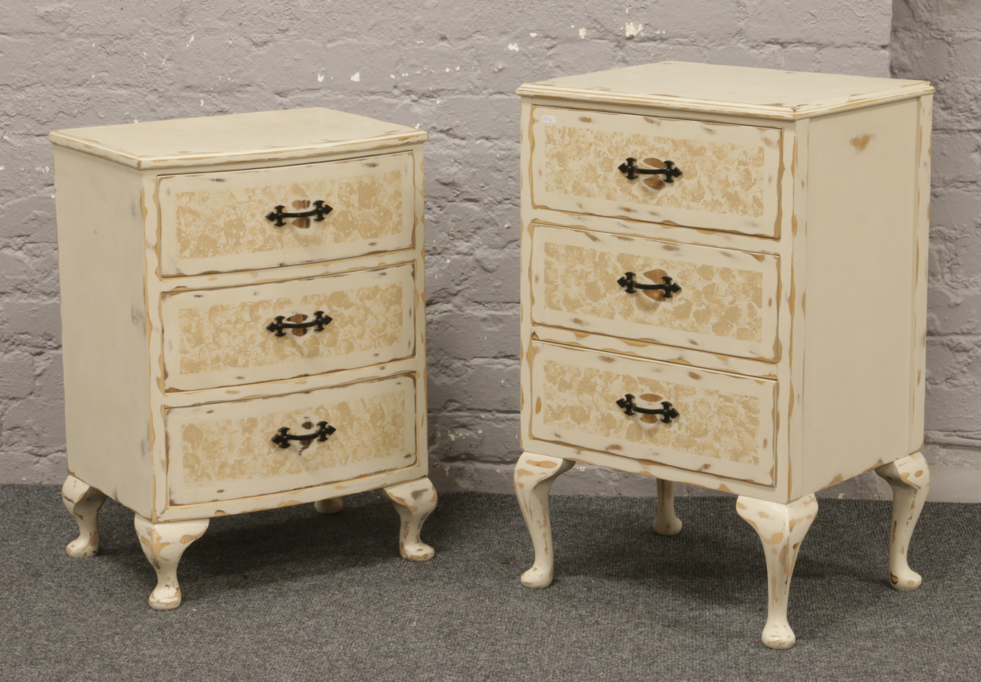 Two painted bedside chests of three drawers.