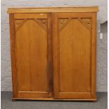 A panelled pine bookcase top with painted interior.