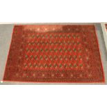 A red ground Royal Keshan Bokhara rug, 170cm x 240cm.