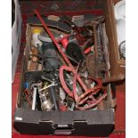 A box of tools including various sized spanners, oil can, sockets, files, drivers etc.