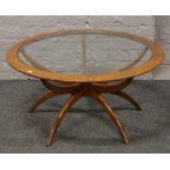 A G plan teak spider coffee table with glass inset top.