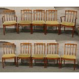 A set of 10 McIntosh slatback dining chairs with green upholstered seats including 2 carvers.