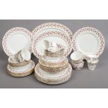 A Coronet bone china dinner service decorated with flowers approximately 65 pieces.
