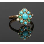 An 18ct gold and turquoise cluster ring, size K.