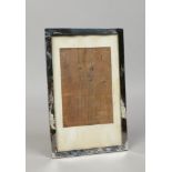 A silver mounted easel photograph frame, assayed Birmingham 1918.