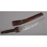 An African short sword with tooled leather grip and scabbard, 41cm blade.