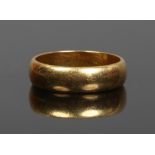 A 22ct gold wedding band. 6 grams, size N.