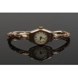 A vintage 9ct gold ladies manual bracelet watch on 9ct gold expanding strap. (Gross weight 13.1g)