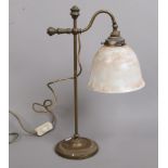 A bronze rise and fall adjustable students lamp with glass shades.