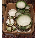 A box of Staffordshire pottery decorated with fruit to include jardiniere, teapot, jugs etc.