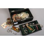 An antique green leather locking jewellery box and contents of good quality costume jewellery and