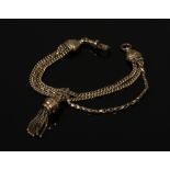 A 9ct gold fob watch chain. With three chains, slider and tassel. Stamped 9ct, 17.8 grams.