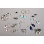 Fourteen pairs of silver earrings including cameo and stone set, hoop and drop examples.