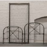 A Victorian iron and brass single bed with original mesh matress support.