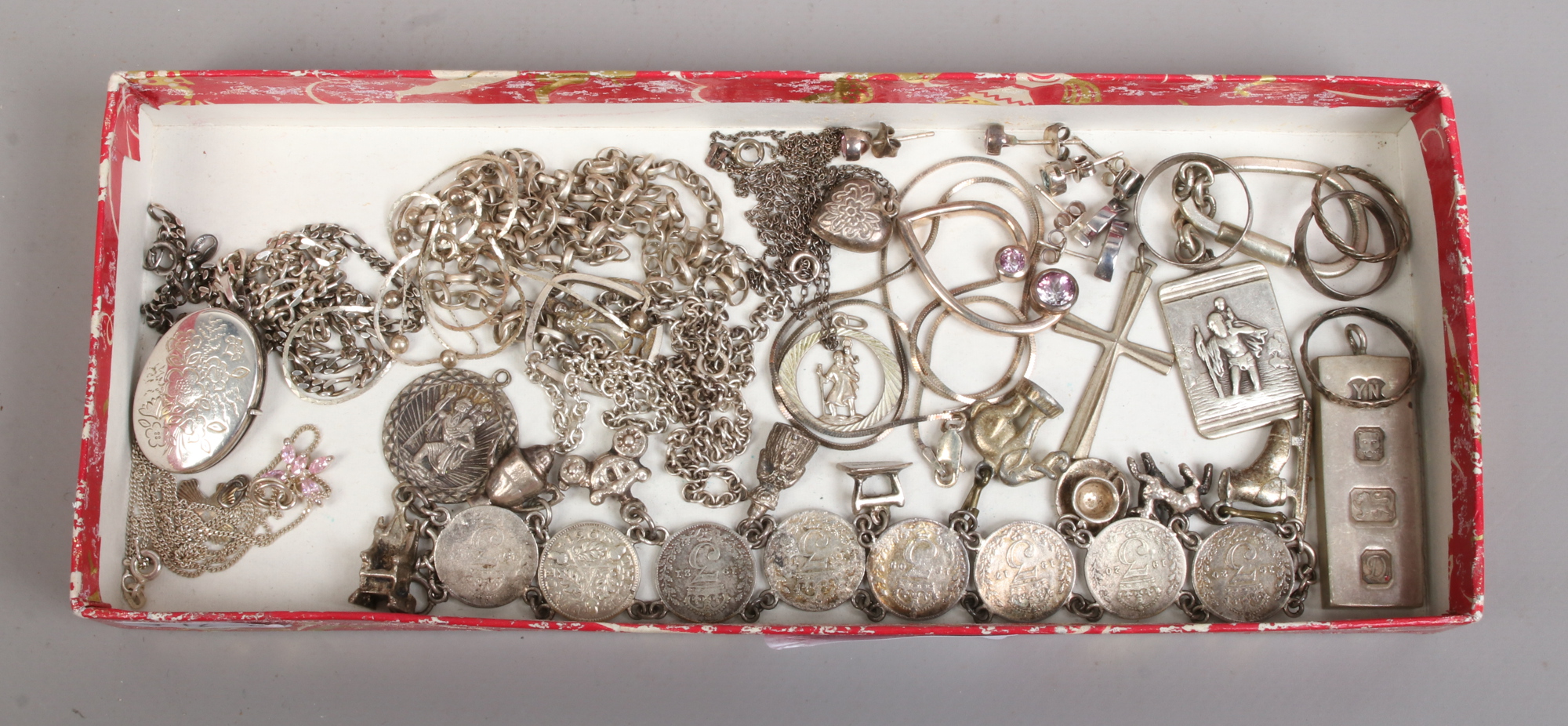 A collection of mostly silver jewellery to include charm bracelet, pendants on chains, rings and