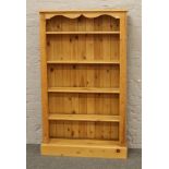 A pine open bookcase, H 153cm x W 92cm x D 28cm.