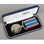 A National Service medal 1939-1960 on ribbon in associated case.