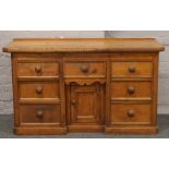 A Victorian pine breakfront sideboard.