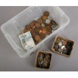 A collection of English and foreign copper / silver coins, along with a Qatar central bank one Riyal