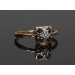 A mid 20th century Art Deco style yellow metal five stone sapphire and diamond ring, size Q.