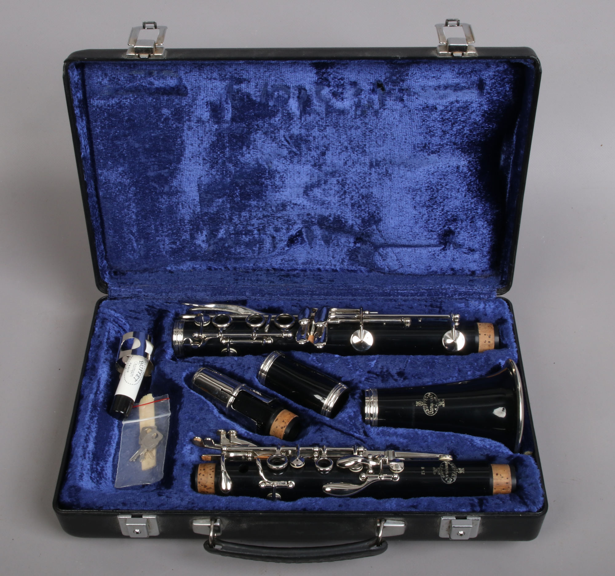 A hard cased Buffet Crampon B12 clarinet with spare reeds cork grease made in Paris France.